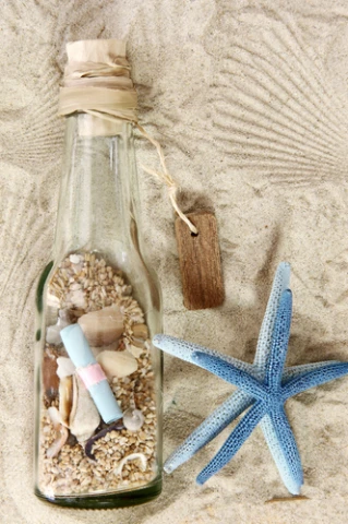 Μπουκάλι με κοχύλια και άμμο