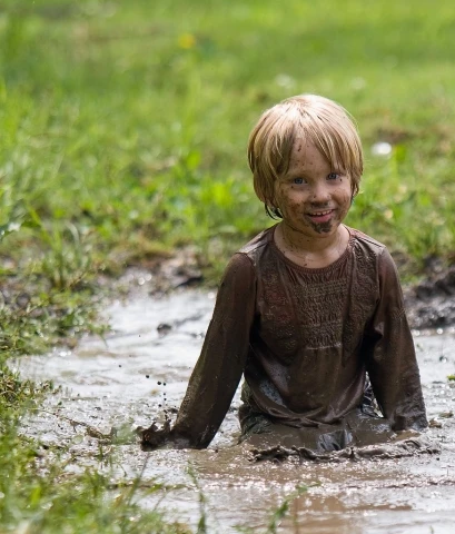 little-boy-playing-in-mud